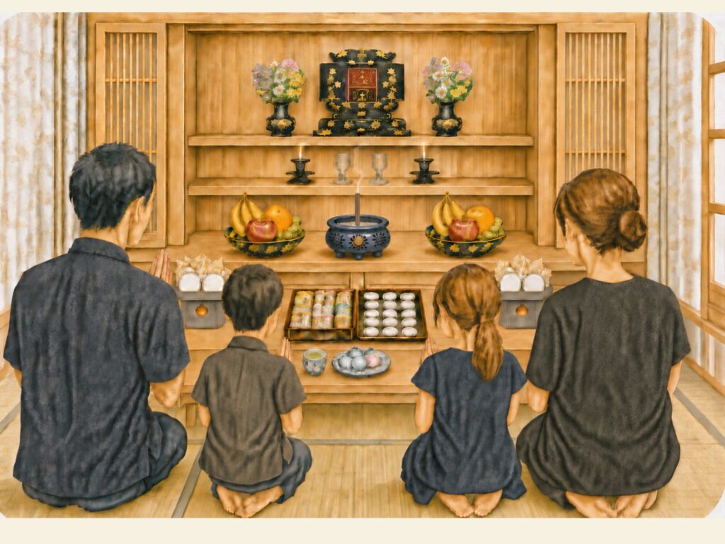 沖縄のミーボン（初盆）で、重箱料理や白餅、果物を供えた仏壇に手を合わせる家族